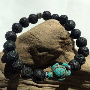 Lava bead and blue turtle bead stretch bracelet